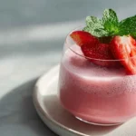 A refreshing pink drink made with fruity flavors and a touch of sweetness.